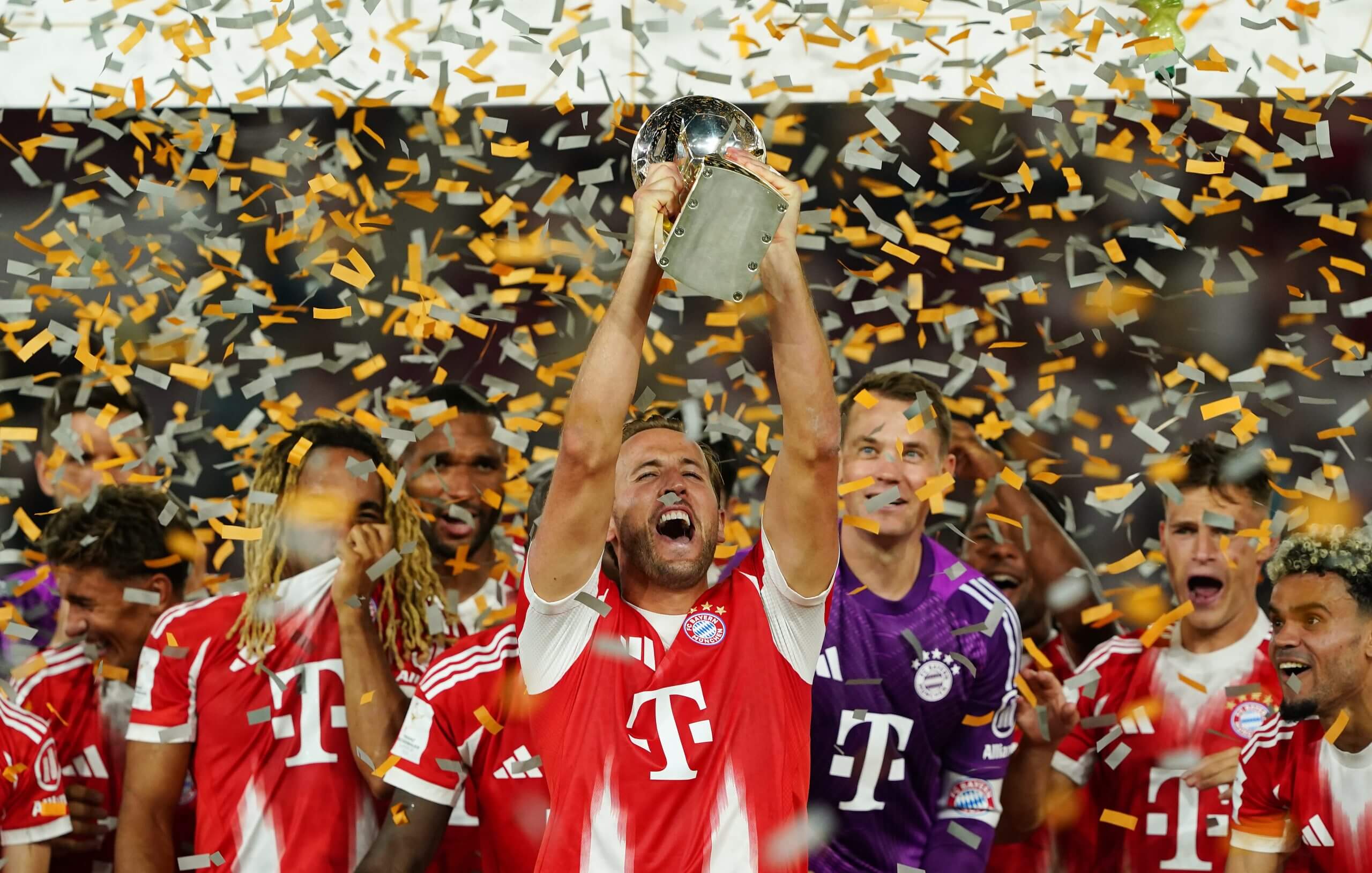 Harry Kane lifts the German Super Cup in celebration