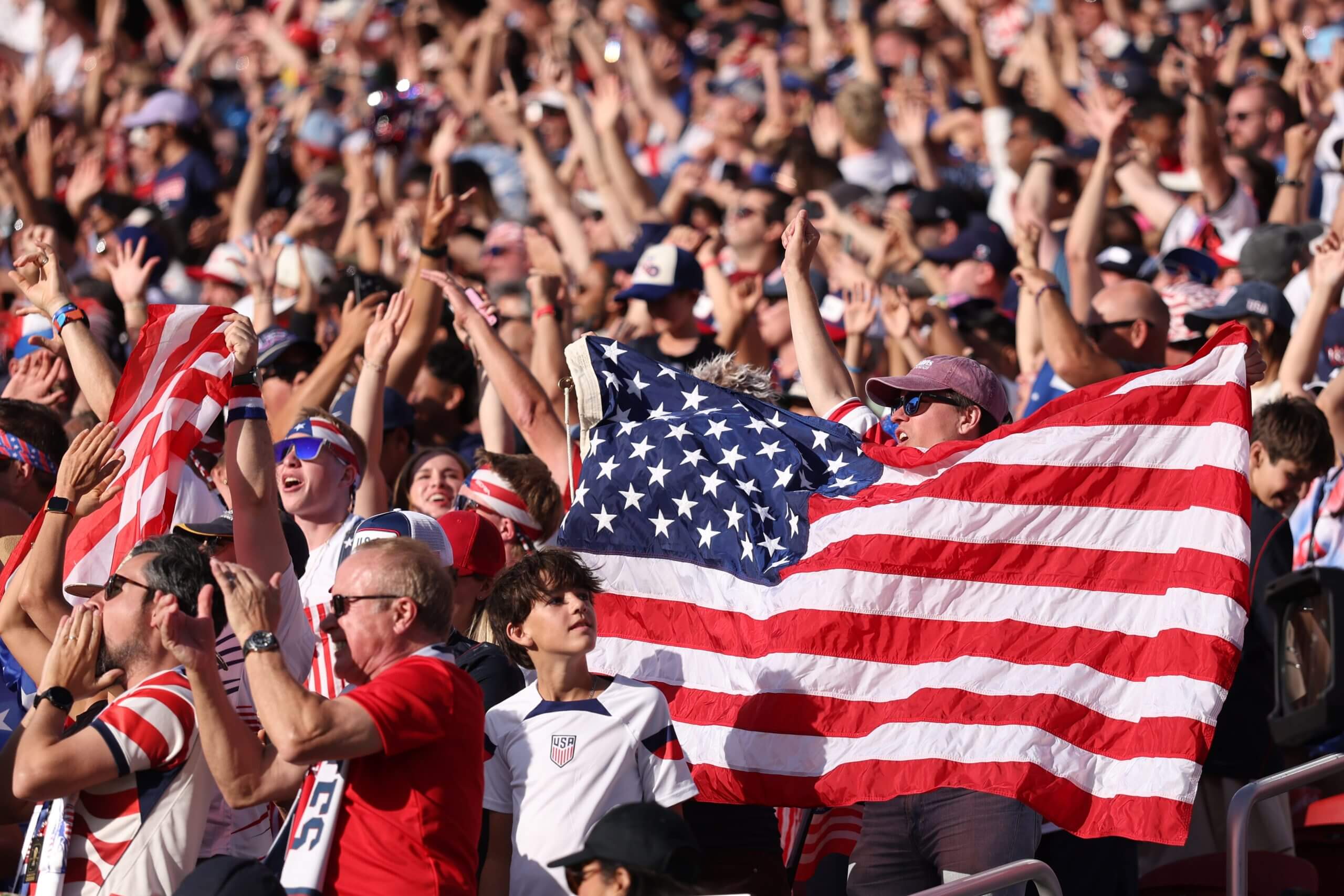 U.S. fans wave the flag during Wednesday night's victory against Bosnia and Herzegovina (Catherine Ivill / AMA / Getty Images)