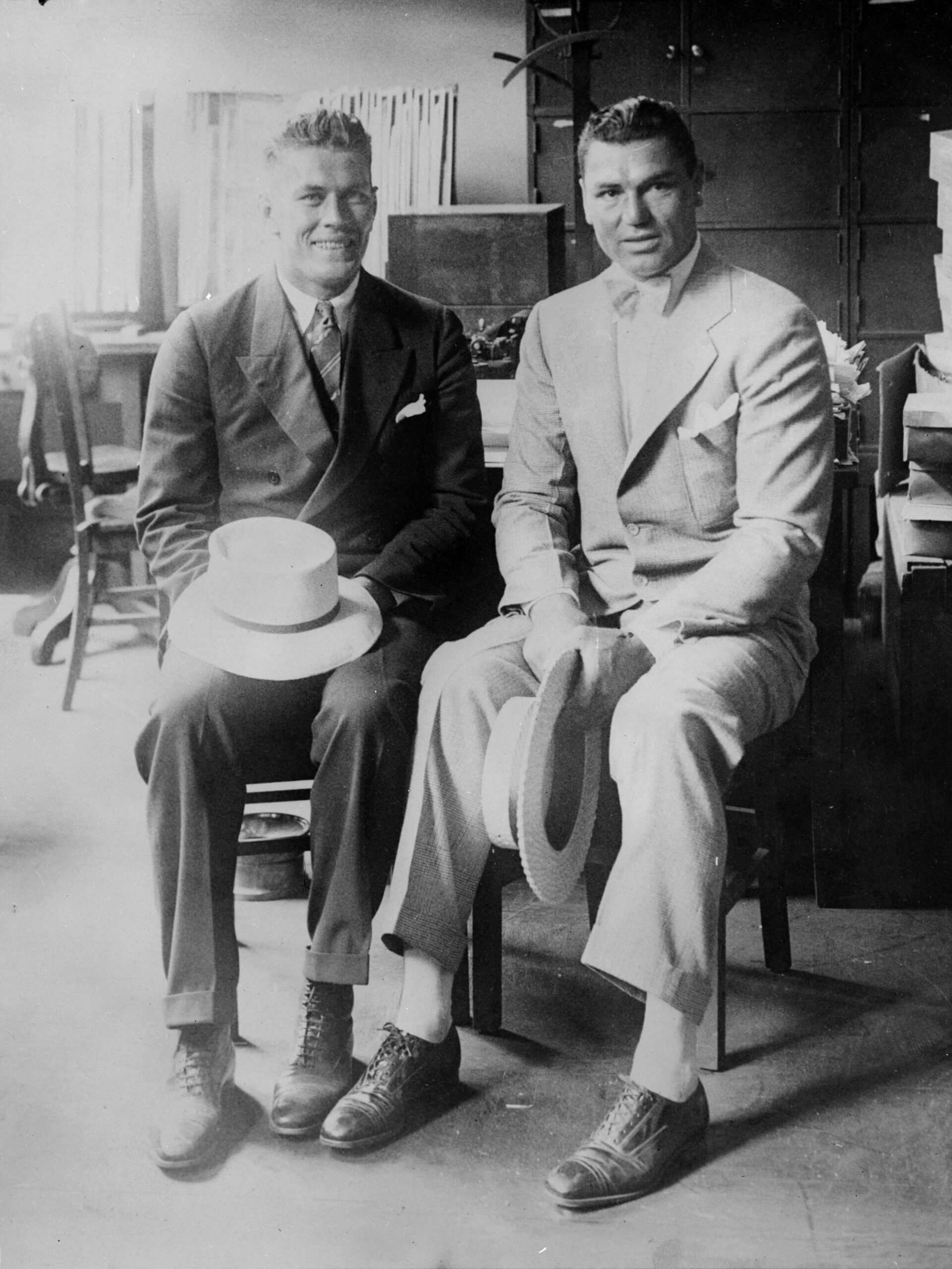 American heavyweight boxers Gene Tunney, left, and Jack Dempsey pose before their bout in 1926 (Topical Press Agency / Getty Images)