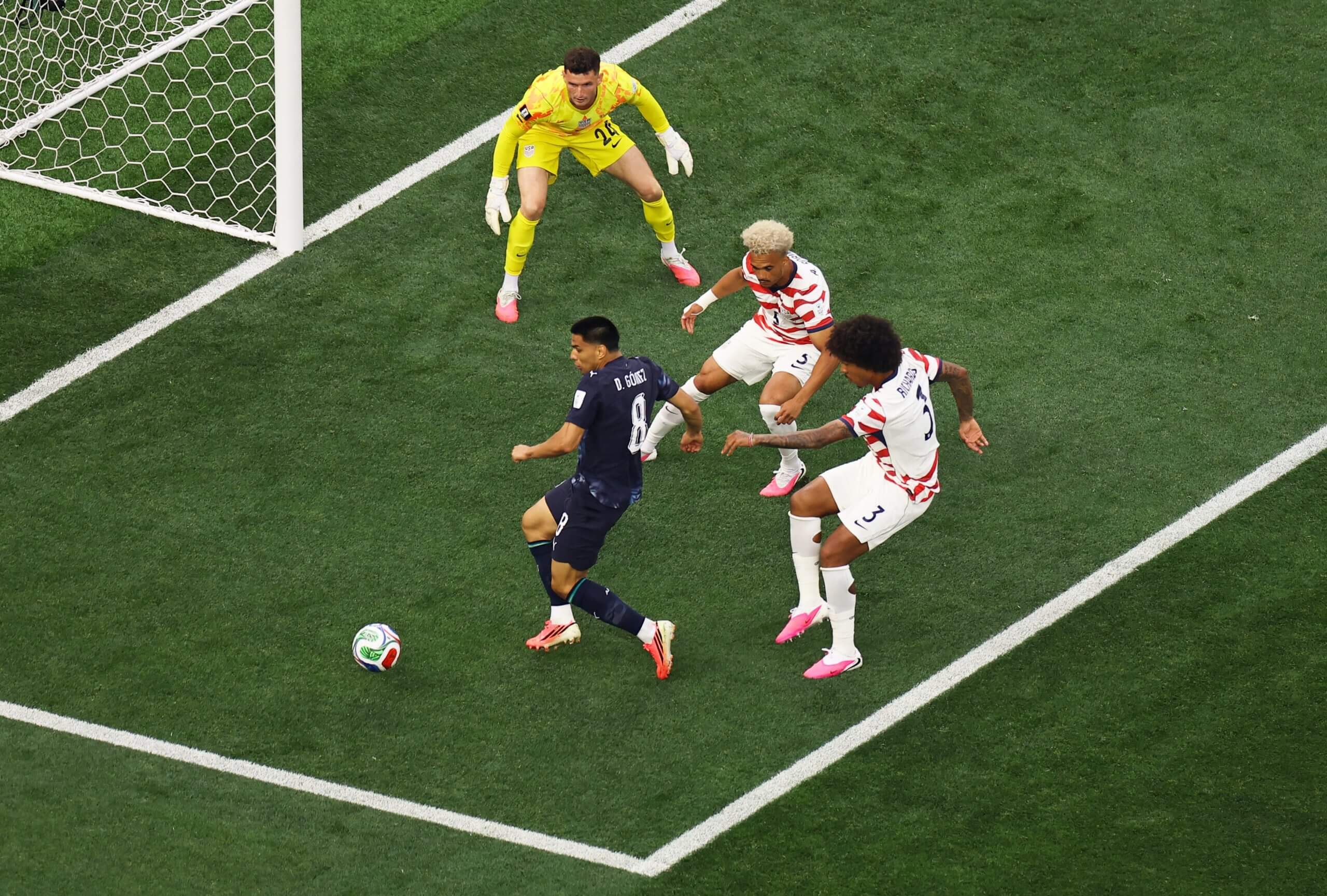 Paraguay's Diego Gomez tries to shoot against the USMNT defense
