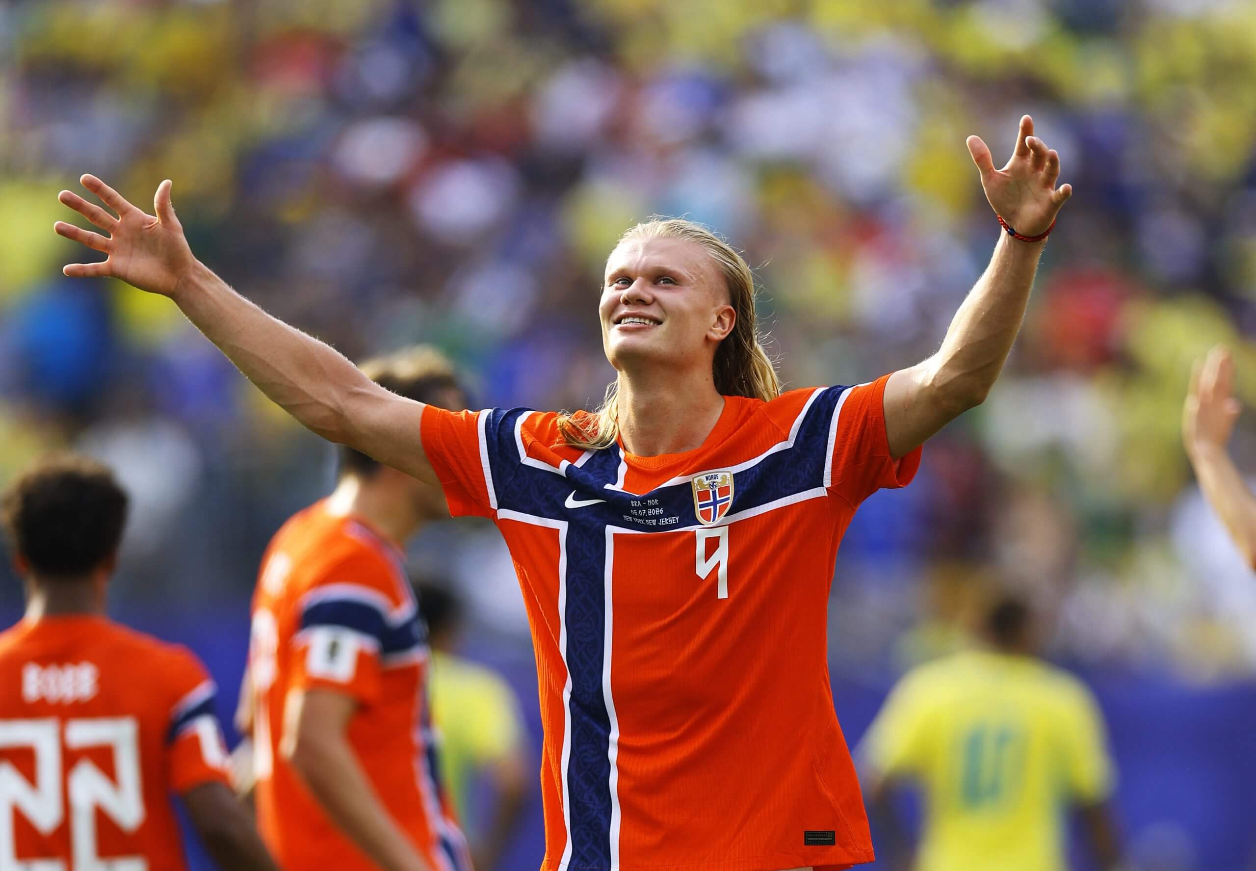 Erling Haaland celebrates with the Norwegian support after beating Brazil