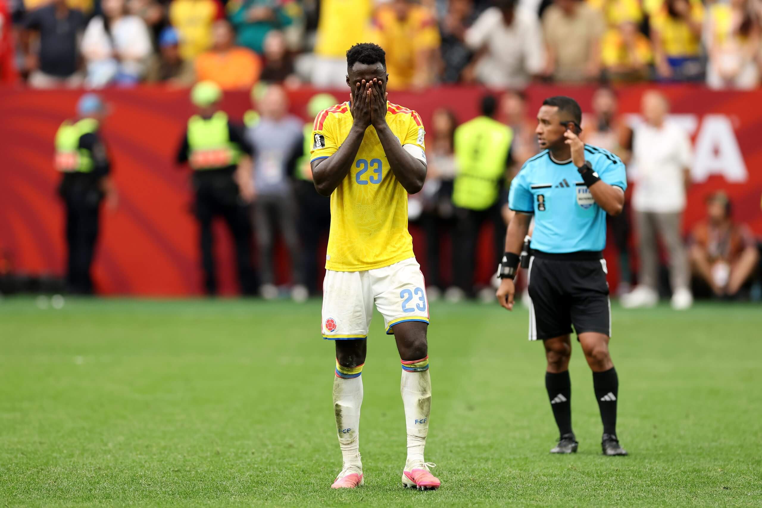 Davinson Sanchez covers his face with his hands after missing his penalty in the shootout against the Swiss