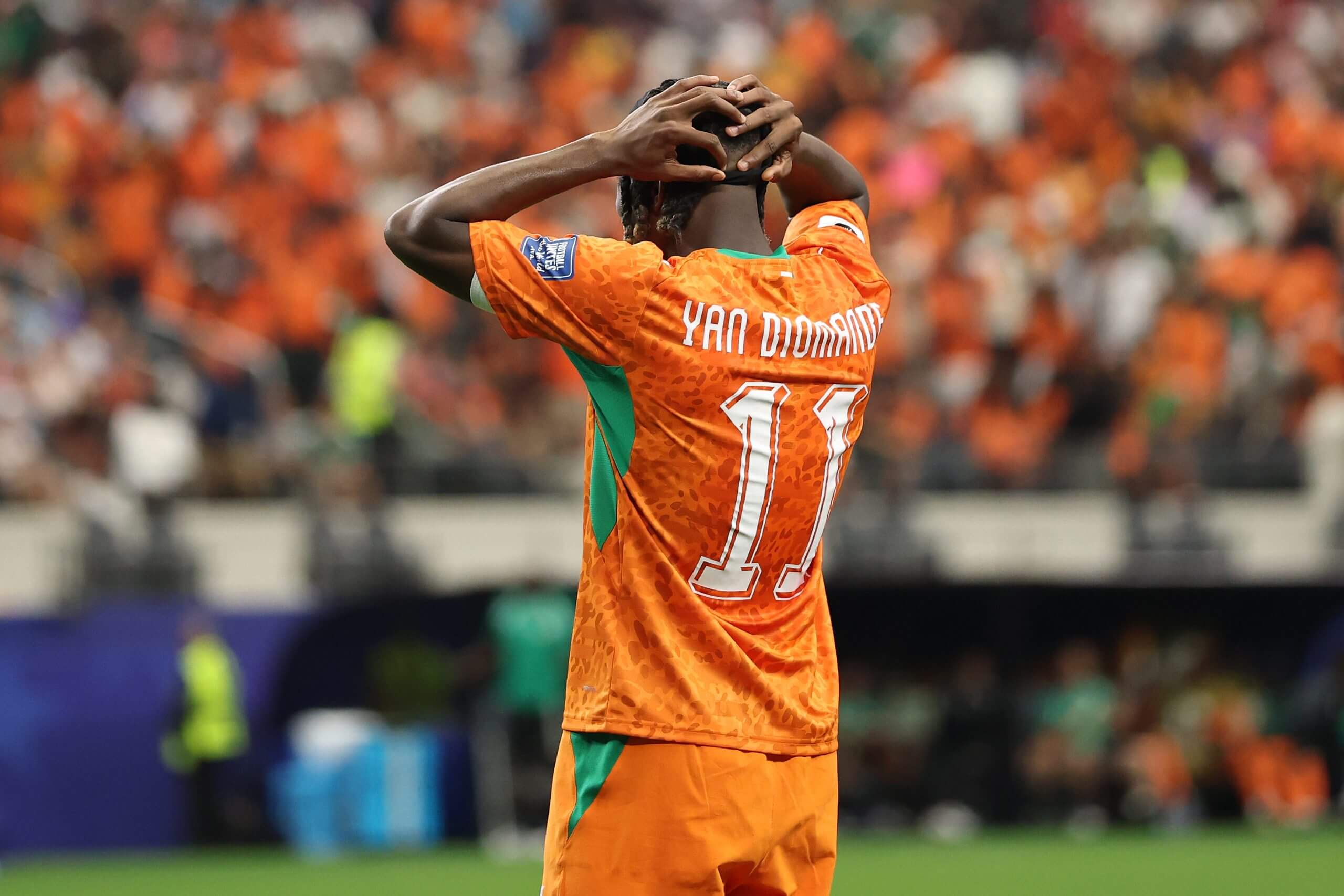 Yan Diomande puts his hands on his head as Ivory Coast exit the tournament