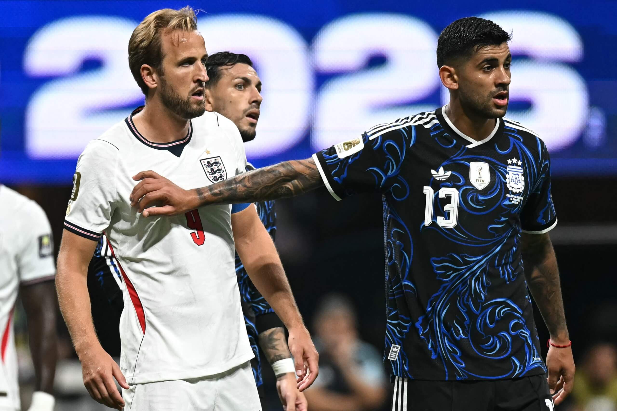 Cristian Romeo pushes Harry Kane in the chest