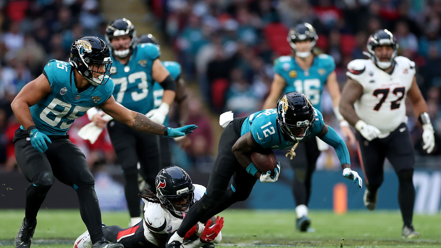 Travis Hunter end zone interception keeps Jaguars alive in London